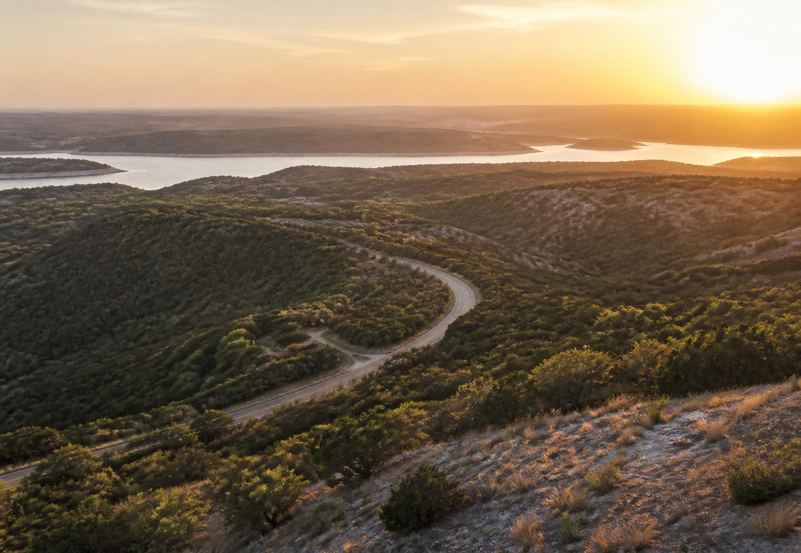 Golden-hour view over the Texas Hill Country and Lake Travis outside Austin